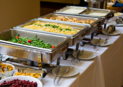 buffet server with food in them all in a row